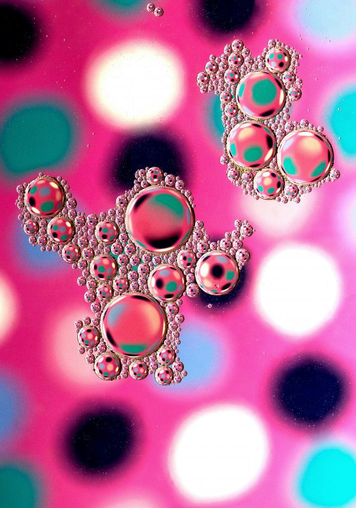 Abstract illustration of clustered lipid nanoparticles on a colourful background, symbolising mRNA drug delivery
